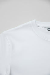Close-up of white premium cotton t-shirt with a comfortable regular fit.